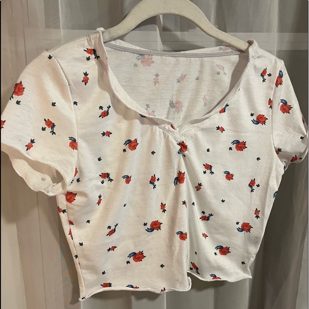 v neck crop top with elastic around neck, arms, & bottom